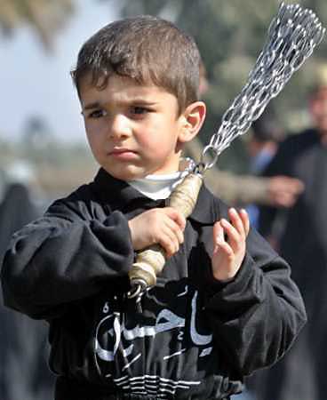 A Shia boy mourning for Imam Hussein in Muharram. Ya Hossein.